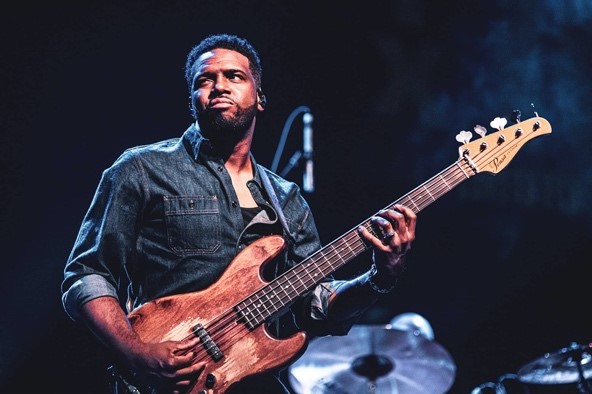 Bassist and Producer Al Carty playing guitar